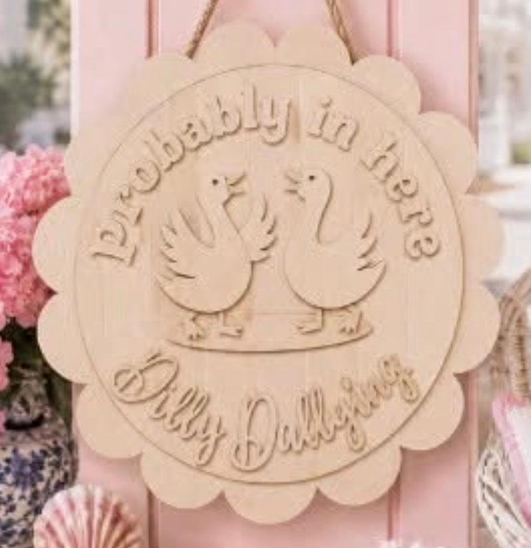 Probably in here Dilly Dallying - scalloped sign